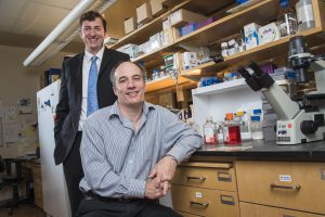 Kurt Rote, left, CEO of Western Oncolytics and Dr. Stephen Thorne, University of Pittsburgh in Dr. Thorne's research lab at the Hillman Cancer Center.
